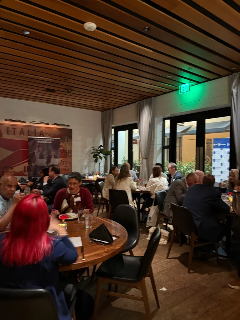 Networking and knowledge exchange during a leadership panel on AI and modern management